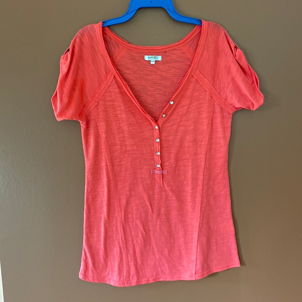 Buffalo ladies T-shirt in beautiful orange in size medium.